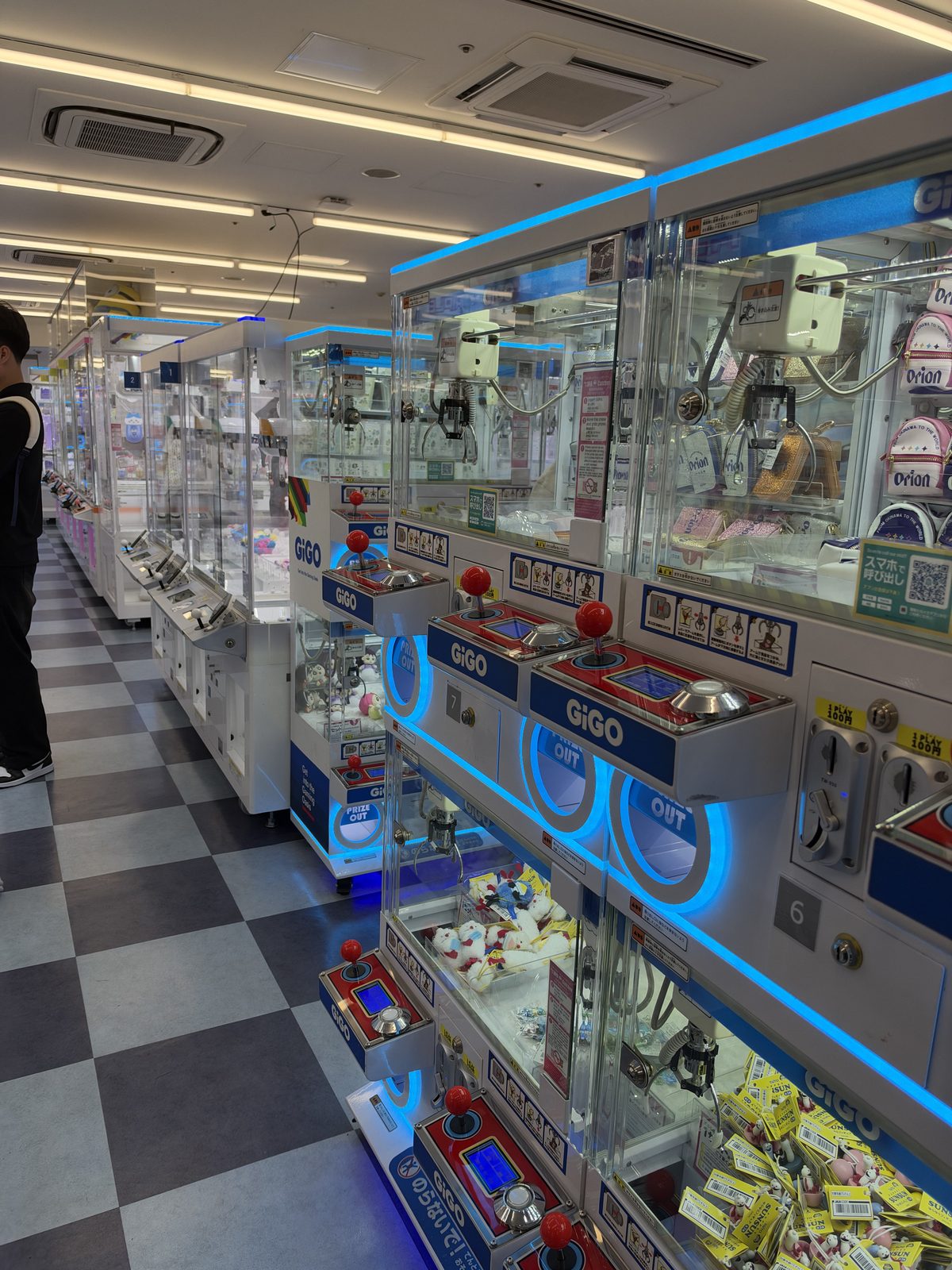 Crane game machines in an arcade, photographed in October 2026.
